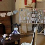 Display of knitted baby items inspired from the numerous babies born at Poltimore Hospital.