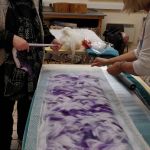 Wet Felted scarf workshop, adding the first layer of wool roving to the silk, Wild about Wool 2019, Poltimore House