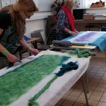 Wet felted scark workshop, adding the layers of wool. Wild about Wool , Poltimore House